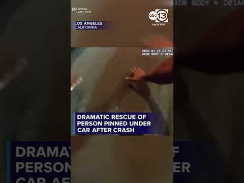 Dramatic rescue of a person pinned under a car
